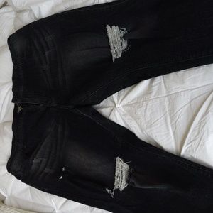Woman's soft black shredded jeans